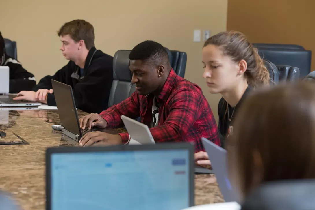 Students working on laptop computers